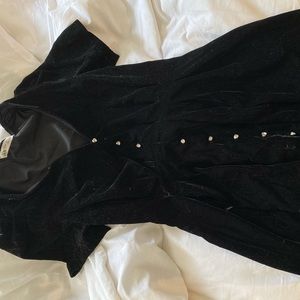 Black velvet mini dress with side zipper and jewel buttons